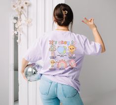 This tee is super soft and comfy! It is cotton t-shirt you will not want to take it off. Front and Back Design with a s super cute kawaii style.  Handcrafted with love in Colorado -Made with Comfort Colors Tee base on ability  -Unisex crewneck t-shirt - Shoulder taping  -Side Seamed *SIZING*(ALL MEASUREMENTS ARE NOT 100% EXACT DUE TO THE HAND DYED PROCESS) Small: 29" Long 18" x Across Chest Medium: 29" Long x 20" Across Chest Large: 30" Long x 22" Across Chest XL: 31" Long x 24" Across Chest XXL: 32" Long x 26" Across Chest *TURN AROUND TIME/ PROCESSING TIME* Our items are made to order. PLEASE GIVE US 10 BUSINESS DAYS TO CREATE YOUR ORDER. *SHIPPING TIMES * First Class 10 business days Priority Mail up to 5 business days   *CUSTOM ORDERS* We absolutely take custom orders! Please do not he Kawaii Tshirt, Kawaii Cotton T-shirt With Crew Neck, Multicolor Kawaii T-shirt For Spring, Multicolor Kawaii T-shirt For Summer, Purple Graphic Print Kawaii T-shirt, Kawaii Pastel T-shirts, Motivational Tshirt, Comfort Colors Tshirt, Health Awareness