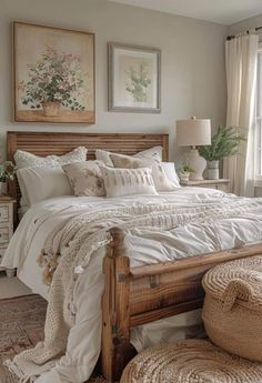 a bed with white linens and pillows in a bedroom next to a large window