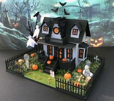 a halloween house with pumpkins and ghost decorations