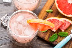 grapefruit, watermelon and mint sprits on a cutting board