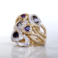 Sterling Silver 18k Gold Plated Ring With Topaz, Amethyst, And Tanzanite Size 9.5 Brand New, Never Worn With Tags 18k Gold Plated Over Sterling Silver Small White Topaz, Amethyst, Smoke Topaz, Blue Topaz, And Tanzanite Finished Under Gallery Ring Size 9.5 Elegant Multi-stone Amethyst Ring In Yellow Gold, Yellow Gold Gemstones For Anniversary, Fine Jewelry Gemstones With Accents For Anniversary, Yellow Gold Amethyst Ring With Gemstone Accents For Anniversary, Elegant Yellow Gold Multi-stone Amethyst Ring, Purple Sapphire Multi-stone Ring With Diamonds, Luxury Multi-stone Birthstone Ring, Elegant Gold Multi-stone Amethyst Ring, Luxury Multi-stone Birthstone Ring For Anniversary