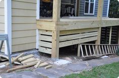 a wooden porch with steps leading up to it