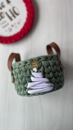 a close up of a green basket on a table