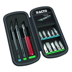 an assortment of pens and pencils in a case