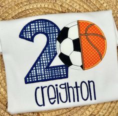 a white shirt with the number twenty two and a basketball ball on it that says crisston