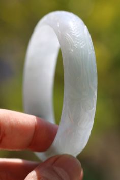 Thank you for looking at this listing! Up for sale is: Carved White Jadeite Jade Asian Chinese Dragon Phoenix Happiness Bangle Bracelet 58.6g (58mm) Used, please see pictures for details on condition. Stone tests in the jadeite jade range and is over 73x15 in outer diameter & width. Inner diameter is 58.79mm. I do not know if it is natural or lab created. I'm not an expert in rating condition, so please look carefully at the pictures and ask questions. What you see is what you get, sold As-I Chinese Ring, Dragon Phoenix, Jade Dragon, Floral Pendant, White Jade, Jade Bracelet, Chinese Dragon, Bracelet Clasps, Cord Necklace