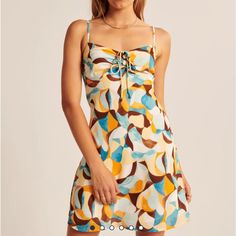 New With Tags Unopened Abercrombie Printed Mini Dress In Size Xxs. Yellow Sundress With Tie Back, Yellow Tie Back Sundress, Yellow Tie-back Sundress, Yellow Summer Mini Dress With Tie Back, Yellow Tie Back Mini Dress For Vacation, Yellow Mini Dress With Tie Back For Brunch, Yellow Mini Dress With Tie Straps, Blue Drawstring Dress For Day Out, Casual Multicolor Mini Dress With Tie Back