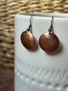 Modern and timeless dainty earrings Lightweight materials Hypoallergenic titanium earring wire and hand hammered and shaped copper disc Mixed metals go with any outfit/jewelry Handmade in Washington, USA Titanium Earrings, Disc Earrings, Hammered Copper, Jewelry Outfit, Dainty Earrings, Mixed Metals, Jewelry Earrings Dangle, Etsy Earrings, Copper