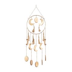 a wind chime with crescents and stars hanging from it's side on a white background