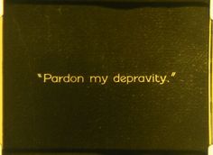 a black and gold case with the words pardon my depravity on it