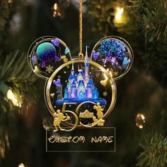 an ornament shaped like mickey mouse's castle hanging from a christmas tree