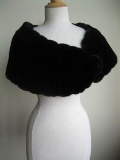 FASHION FURS Item Description: Exceptional quality and a glamorous look. Crafted from natural dark ranch/black mink fur pelts, it is designed to keep you warm and stylish. The soft and smooth texture of the Canadian full mink fur pelts ensures top quality. The stole is completed with a furrier closure and a mink fur pom pom at the front, while the black satin lining adds a touch of elegance. With measurements of 60" x 14", this stole is a must-have for any fashion-forward individual. Mink Stole, Cape Shawl, Fur Accessories, Wedding Wraps, Mink Fur, Fur Pom Pom, Smooth Texture, Shawls And Wraps, Black Satin