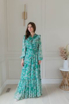 Get ready to turn heads this summer with my enchanting Bohemian Flower Maxi Dress. Designed for the free spirit in you, this stunning Boho Maxi Dress is perfect for those sunny days and magical evenings. With its flowing silhouette and delicate ruffles, it exudes effortless elegance and romantic charm. Whether you're headed to a beach wedding, a garden party, or just enjoying a day out, this long sleeve dress will be your go-to choice. I've crafted this beauty from lightweight chiffon, so it drapes beautifully and feels wonderful against your skin. The vibrant floral print adds a whimsical touch that's sure to brighten your wardrobe. Plus, the flattering belt cinches at the waist, helping you highlight your unique style. This versatile piece transitions seamlessly from casual outings to mo Flower Maxi Dress, Bohemian Flower, Bohemian Flowers, Belt Dress, Maxi Robes, Summer Maxi, Boho Maxi, Dress Gift, Effortless Elegance