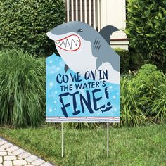 a sign that says come on in the water's fine with a dolphin jumping out of it