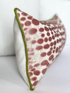 a white pillow with brown spots on it