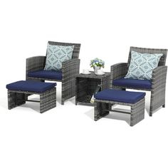 an outdoor furniture set with blue cushions