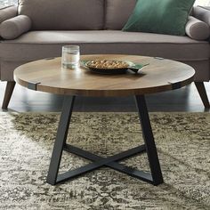 a living room scene with focus on the coffee table and sofa in the foreground