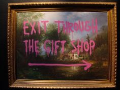 a painting with the words exit through the gift shop painted on it's side