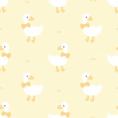 a yellow and white ducky pattern on a light colored background that is very cute