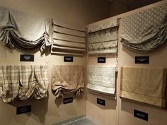 several different types of curtains hanging on the wall