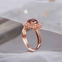 Elegant and delicate, this vintage engagement ring will capture your heart at first sight. Crafted in rose gold tone sterling silver, this ring features a cushion cut center stone wrapped in a luxurious halo, which glistens with round stones and adorned with milgrain detailing. Along the milgrain-edge shank, a row of shimmering stones are paved on it to perfect the design and add extra sparkle to the ring. Treat yourself or surprise her with this masterpiece.Weight: 4.31 gWidth: 12.5 mmHeight: 6 Elegant Cushion Cut Rose Gold Diamond Ring, Luxury Rose Gold Halo Promise Ring, Elegant Rose Gold Cushion Cut Wedding Ring, Rose Gold Cushion Cut Diamond Promise Ring, Rose Gold Cushion Cut Rings For Formal Events, Rose Gold Cushion Cut Rings For Formal Occasions, Elegant Rose Gold Halo Promise Ring, Elegant Rose Gold Promise Halo Ring, Rose Gold Halo Ring With Diamond Accents For Promise