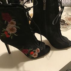 Gorgeous Black Embroidered Lace Up Booties. Size 6 1/2. New, Never Worn. Party Heels With Floral Embroidery And Round Toe, Floral Embroidered Fitted High Heels, Fitted Floral Embroidered High Heels, Embroidered Closed Toe Party Boots, Floral Embroidered Evening Heels For Spring, Embroidered High Heel Boots For Spring, Open Toe Heels With Floral Embroidery For Evening, Black Embroidered Heels For Spring, Party High Heel Embroidered Boots