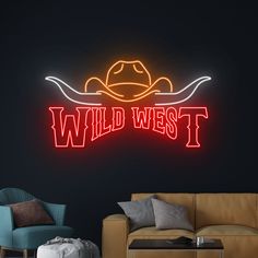 a neon sign that says wild west with a cowboy hat on the front and back