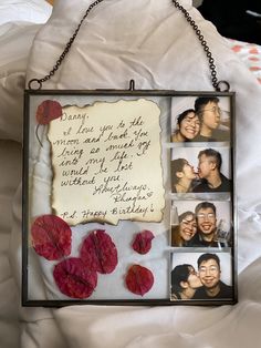 a photo frame with four photos and a message attached to it, hanging on a chain