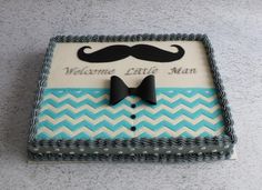 a birthday cake with a mustache and bow tie on the top is for a man