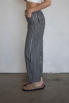 Striped, tapered pants with barrel fit and front and back pockets. - Sizing: Model is 5'8", wearing a size S 27" inseam - Content: 100% Cotton Care: Handwash recommended Imported Dress Home, Tapered Pants, Black Pants, Black Color, Barrel, Lookbook, Pants, How To Wear, Dresses