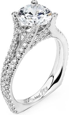 a white gold engagement ring with diamonds on it