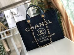 Description CC Deauville Tote Canvas Bag Dark Blue For Women 14.9in/38cm Rep 1:1 Measurements: 38 x 30 x 18 cm / 14.9 x 11.8 x 7 inches ( Length x Width x Height ) Chain Dark Blue Zipper inside Medal hardware Include dust bag. This product is of the best quality. Louis Vuitton Shirt, Chanel Shirt, Bag Dark, Chanel Deauville Tote Bag, Evening Clutch Bag, Hermes Bag, Short Bob, Chanel Handbags, Tote Backpack