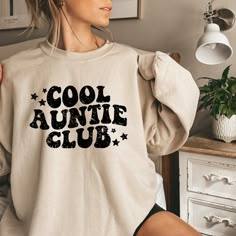 "✅ITEM DESCRIPTION✅ Cool Auntie Club Sweatshirt, Retro crewneck, Aunt Shirt, Birthday gift for Aunt, New aunt hoodie, Groovy Aunt Club, Gift for sister, This retro, \"Cool Auntie Club\" is trendy, cozy and perfect for the cool auntie in your life. Great for a birthday gift for aunt, sister or aunt-to-be. 🌟Welcome to CardaCreationsCo🌟 🌻CARDACREATIONSCO🌻 Thanks for choosing to shop with us! We hope you love our items as much as we do. If you don't see what you are looking for please send us a Casual Long Sleeve Birthday Sweatshirt, Birthday Sweatshirt With Graphic Print In Relaxed Fit, Casual Name Print Sweatshirt For Winter, Casual Hoodie With Name Print, Casual Graphic Print Sweatshirt For Birthday, Casual Winter Sweatshirt With Name Print, Casual Birthday Sweatshirt With Lettering, Birthday Letter Print Relaxed Fit Sweatshirt, Casual Sweatshirt With Lettering For Birthday