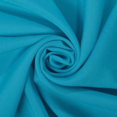 a close up shot of the fabric in turquoise blue, which is very soft and smooth