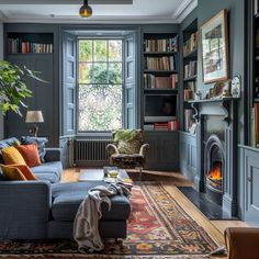 a living room filled with furniture and a fire place in the middle of it's walls