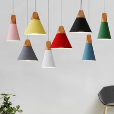 an assortment of multicolored lights hanging from the ceiling