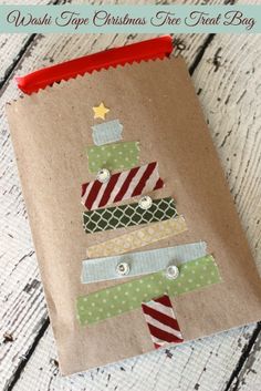 a brown paper bag with a christmas tree on it and the words washi tape christmas tree treat bag