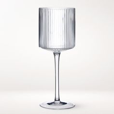 an empty wine glass sitting on top of a table