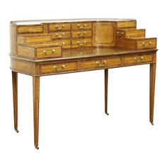 an antique desk with drawers on each side