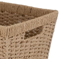 a large woven basket with handles on the bottom is shown in light brown and beige