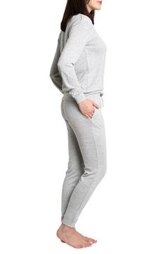 Some long pajamas feature a soft knit design against a crewneck top and matching jogger styled pants. Top has crewneck, long sleeves Pants have elastic waist 97% polyester, 3% spandex Machine wash, tumble dry Imported Model stats: 5'10" height, 32" bust, 25" waist, 36" hip. Model is wearing size S. Long Pajamas, Womens Loungewear Sets, Fashion Joggers, Loungewear Set, Joggers Womens, Jogger Set, Womens Loungewear, Knitting Designs, Pajama Set