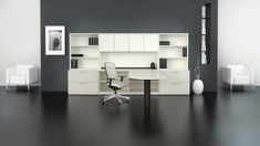 an office with black walls and white furniture