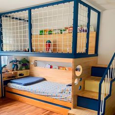 a child's bedroom with a bunk bed and stairs leading up to the second floor