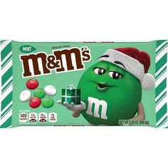 m & m's mint candy bar with santa hat holding a box of m and m's candies