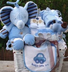 a baby gift basket filled with blue items