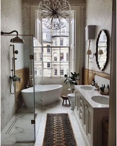 an instagram photo of a bathroom with a bathtub, sink, and shower