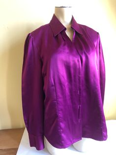 Women's Magenta Size 16  by East 5th  Satiny Button Front Blouse  With Bust Darts,  Princess Seams and tiny side vents for shaping 100% Polyester Made in Indonesia  Machine Wash Warm  This blouse is vintage 1990's but was very well cared for. Fitted Blouse With Button Closure, Purple Fitted Button-up Blouse, Fitted Classic Blouse With Covered Buttons, Formal Fitted Blouse With Button Closure, Fitted Formal Blouse With Buttons, Formal Fitted Blouse With Buttons, Classic Fitted Blouse With Button Closure, Purple Button-up Blouse For Formal Occasions, Fitted Purple Button-up Top