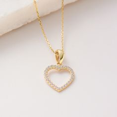 "Shining Channel Heart Pendant, Solid Gold 10K 14K 18K, CZ Simulated Diamond  Necklace, Cubic Zieconia Heart Pendant/Charm Jewelry for everyday wear  Sizes of the *Hexagon Star Heart Pendant* * 0.4inch /  10mm (excluding bail) * 0.6inch /  15mm (including bail) * 100% 10K 14K 18K Solid Yellow Gold (Not Gold Vermail or Not Gold Plated) * Price includes the chain when \"Pendant and Chain option\" is chosen. * Cubic Zirconia clear simulated diamonds * Shining Channel Heart Pendant is a lightweight item. * Polished finish EU and UK taxes; *EU and UK orders over £135/€150 are subject to customs, import duties and tax charges once they reach their destination. This means that the recipient will be responsible for all customs, import duties and sales taxes that may apply at Eu or UK to the purcha Fine Jewelry Yellow Gold Heart Cut Necklace, Fine Yellow Gold Heart Necklace, Fine Yellow Gold Heart Cut Necklace, Yellow Gold Heart Cut Birthstone Necklace, Gold Plated Heart Necklace Fine Jewelry, Gold Plated Heart Necklace In Fine Jewelry Style, Gold Heart Cut Necklace, Gold Heart Cut Diamond Necklace, Gold Heart Cut Birthstone Necklace