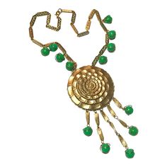 This is part of Chairish’s Costume Jewelry assortment.  Vintage Gold Green Statement Necklace 1970s Sunflower Dangles Beads  ------------------  Stylish gold necklace with beautiful green round beads...the middle pendant is a sunflower design...multiple green beads at the chain plus 5 dangles each ending with that same green bead encased in gold...secure closure.  Overall length of chain: 18"   Plus total pendant drop: 5.50" Vintage Green Dangle Necklaces, Vintage Green Beaded Chain Jewelry, Vintage Green Jewelry With Beaded Chain, Vintage Green Pendant Beaded Necklace, Vintage Green Necklace With Beaded Chain, Green Costume Jewelry Necklace With Dangling Beads, Green Sunflower, Green Statement Necklace, Green Beads