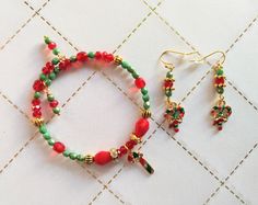 This festive Candy Cane Jewelry Set is perfect for any Christmas outfit! Sparkling Czech glass in red and green, as well as shiny enamel on metal candy cane charms, set a lovely holiday mood. Holly jolly--and one of a kind! Candy Cane Color Jewelry, Holiday Mood, Christmas Jewelry, Holly Jolly, Green Bead, Christmas Outfit, Czech Glass, Candy Cane, Jewelry Set